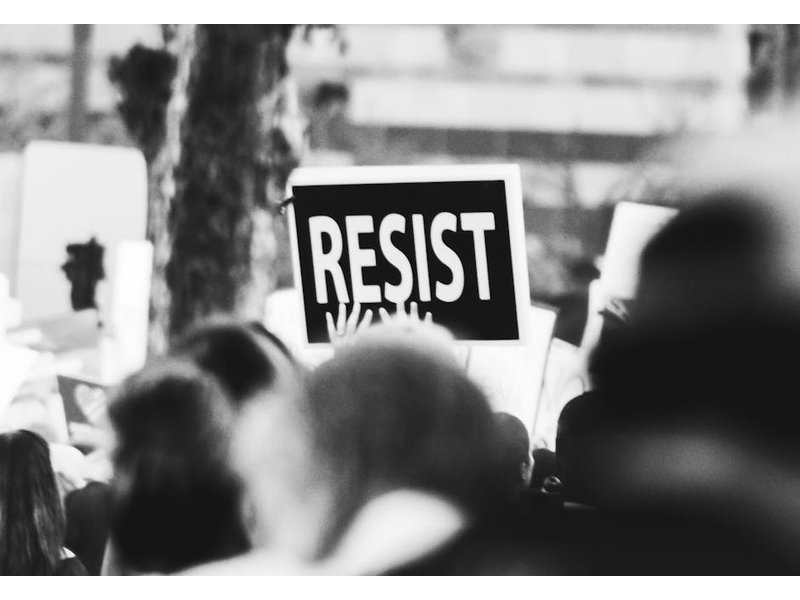 022 protest disrobings banner